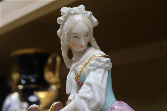 A pair of Paris porcelain figural bowls and a rolling pin